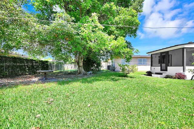 2261 SW 26th St, Miami, FL 33133 - view of yard featuring a sunroom