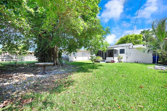 2261 SW 26th St, Miami, FL 33133 - view of yard with a sunroom