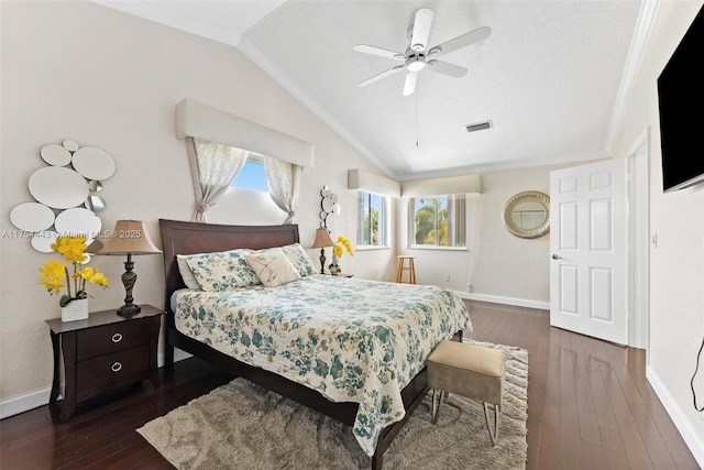 bedroom featuring visible vents, baseboards, lofted ceiling, and hardwood / wood-style floors