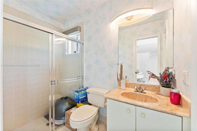 bathroom featuring toilet, a stall shower, and wallpapered walls