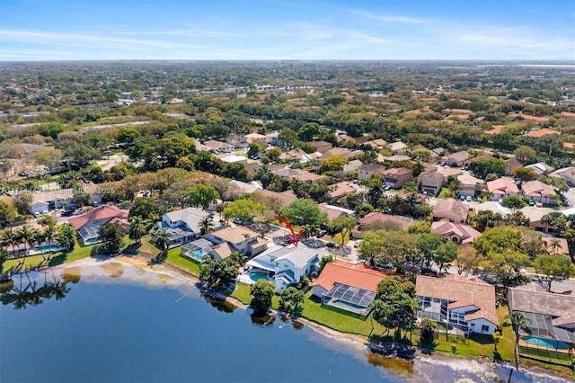 drone / aerial view featuring a residential view and a water view