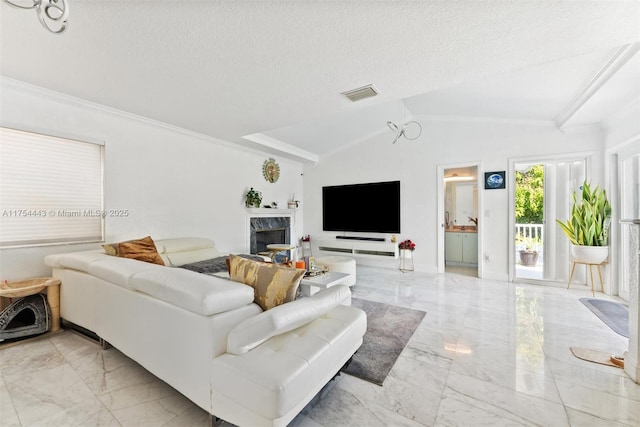 living area featuring vaulted ceiling, visible vents, marble finish floor, and a textured ceiling