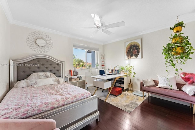 bedroom featuring a ceiling fan, crown molding, baseboards, and hardwood / wood-style floors