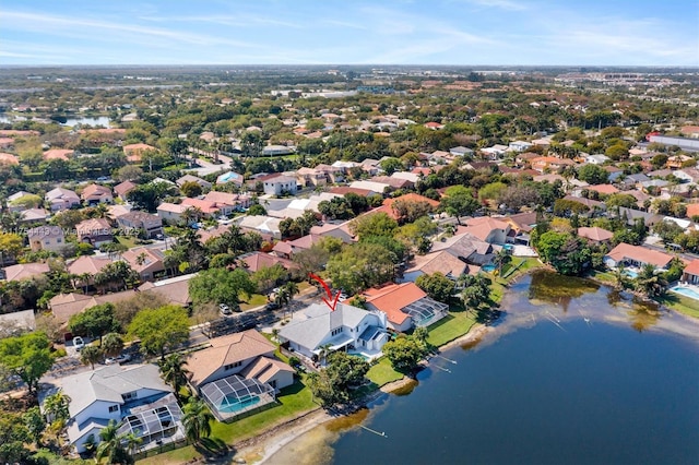 bird's eye view featuring a residential view and a water view