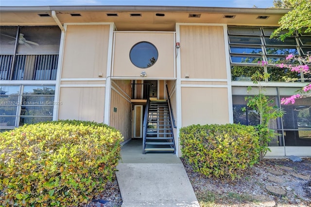 view of property featuring stairs