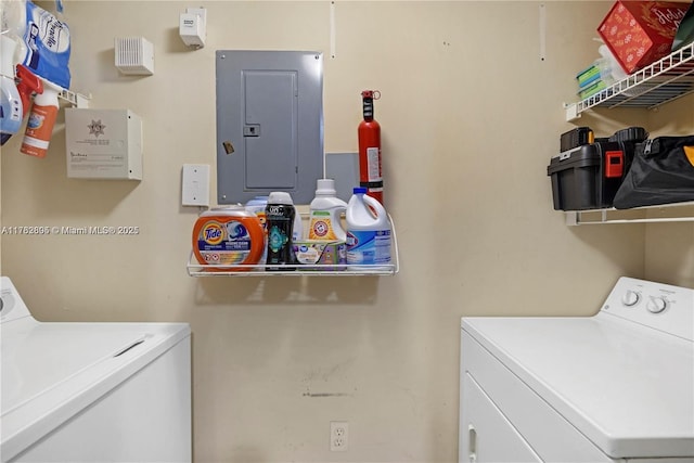 laundry area featuring laundry area, electric panel, and independent washer and dryer