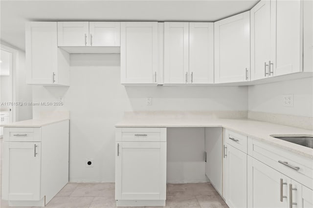 kitchen featuring white cabinetry