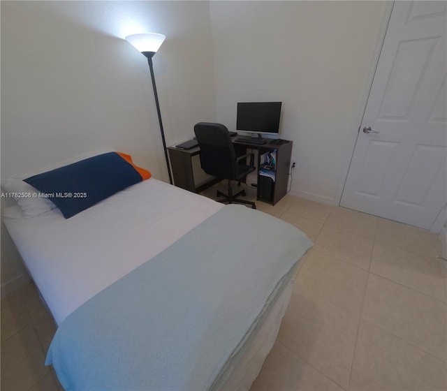 bedroom featuring light tile patterned flooring