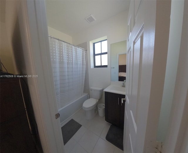 bathroom featuring visible vents, toilet, shower / bath combo, tile patterned flooring, and vanity