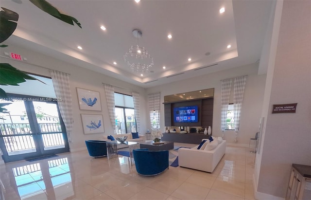 living area with light tile patterned floors, recessed lighting, a raised ceiling, and baseboards