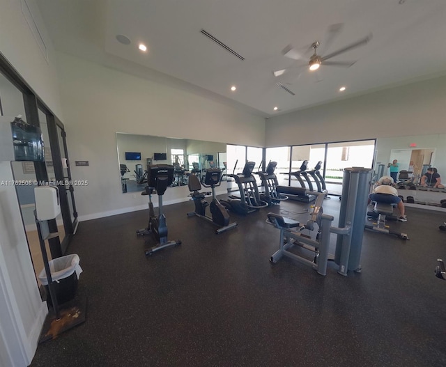 exercise room featuring a ceiling fan, baseboards, visible vents, a high ceiling, and recessed lighting