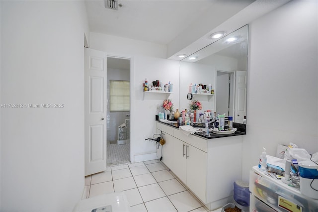 bathroom with tile patterned floors and visible vents