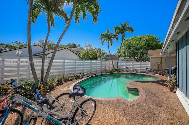 view of pool with a fenced backyard and a fenced in pool