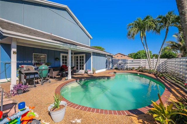 view of swimming pool with a patio, a fenced backyard, and a fenced in pool