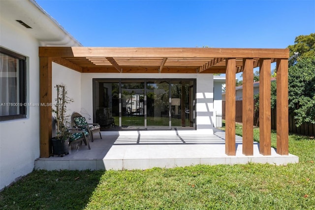 exterior space featuring a pergola and fence