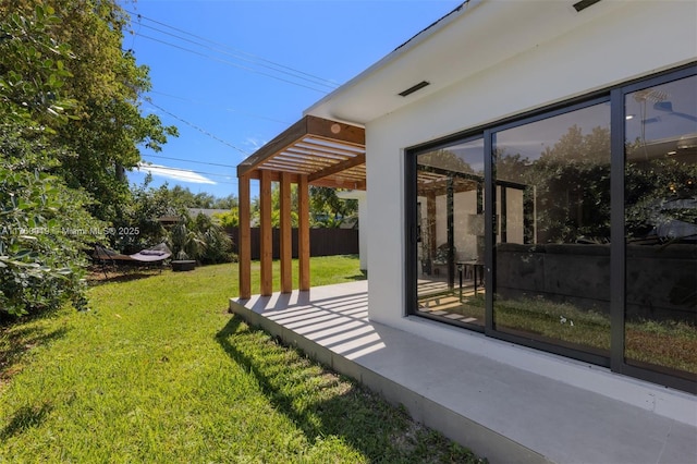 view of yard featuring fence and a pergola