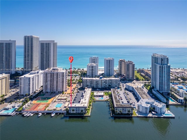 aerial view featuring a view of city and a water view