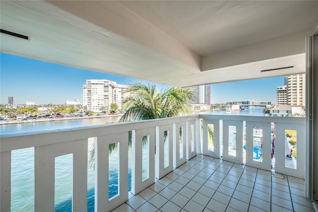 balcony featuring a view of city and a water view