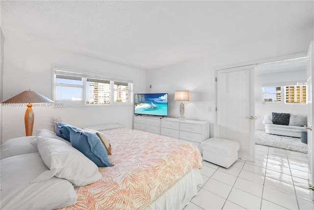 bedroom with light tile patterned floors