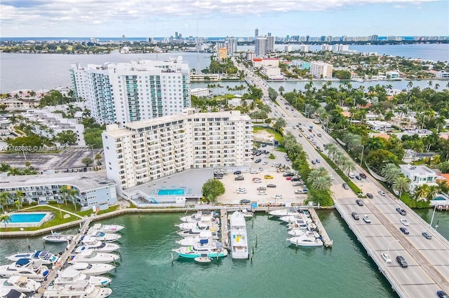 aerial view featuring a view of city and a water view