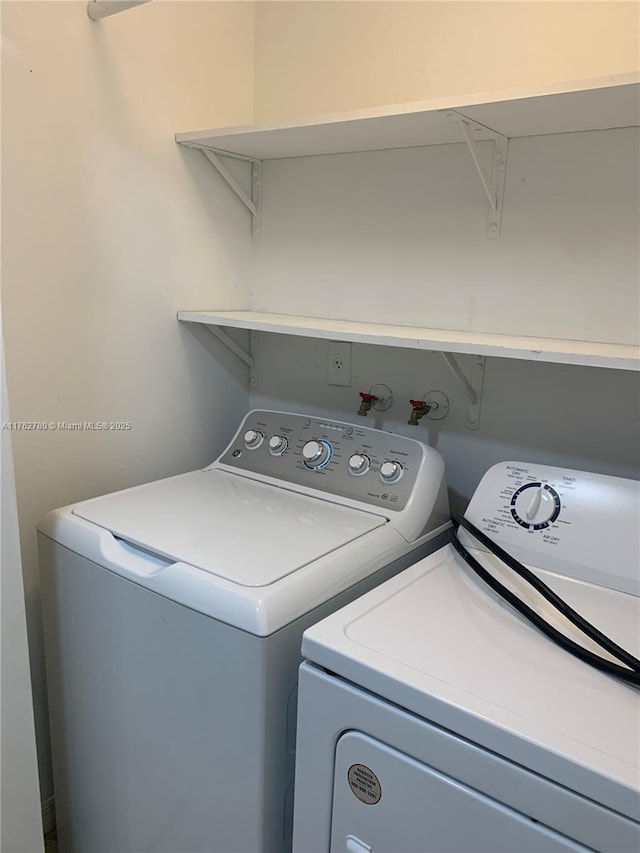 washroom with independent washer and dryer