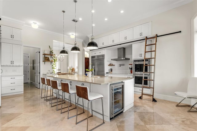 8111 SW 178th St, Palmetto Bay, FL 33157 - kitchen with wine cooler, backsplash, a barn door, wall chimney exhaust hood, and appliances with stainless steel finishes