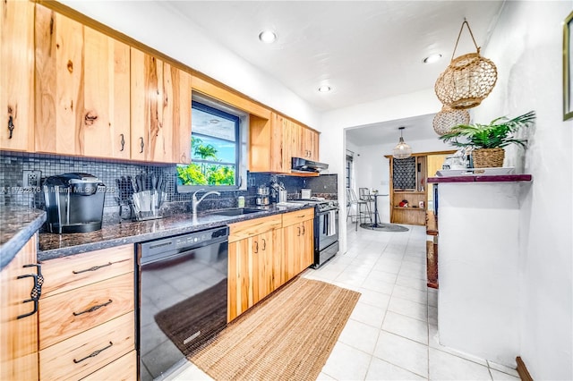 kitchen featuring tasteful backsplash, ventilation hood, light brown cabinetry, black appliances, and a sink