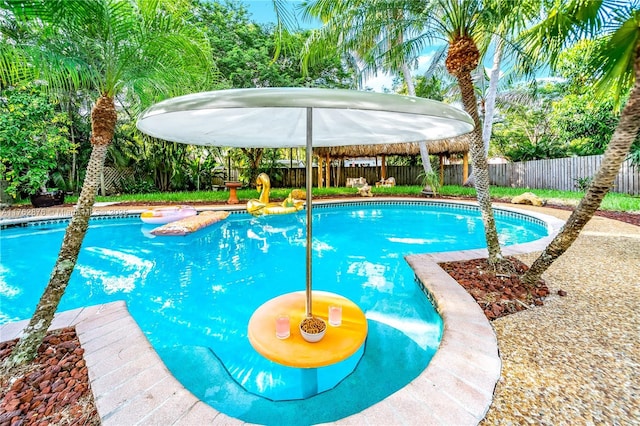 view of swimming pool featuring a fenced in pool and a fenced backyard