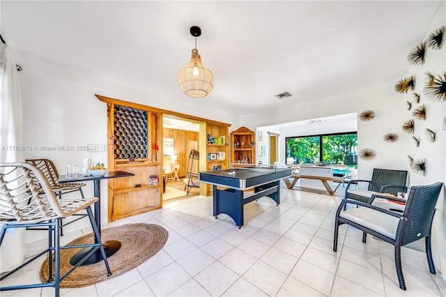 game room featuring light tile patterned floors and visible vents