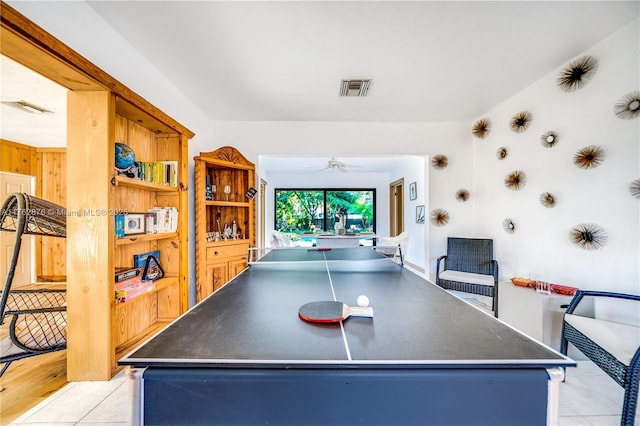 rec room with light tile patterned floors, visible vents, and a ceiling fan