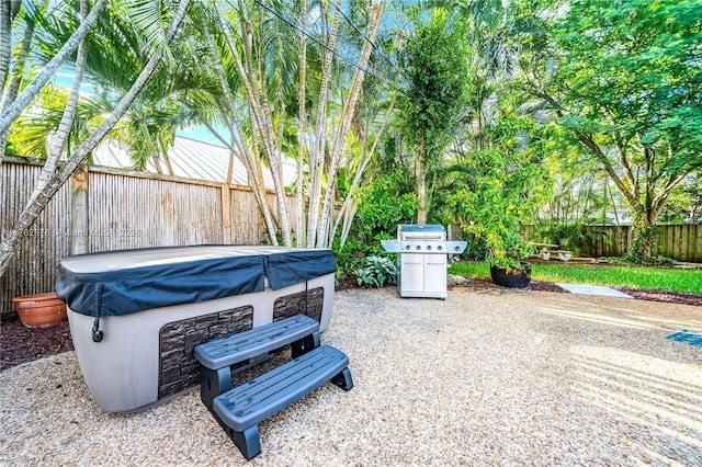 view of patio / terrace featuring a fenced backyard and a grill