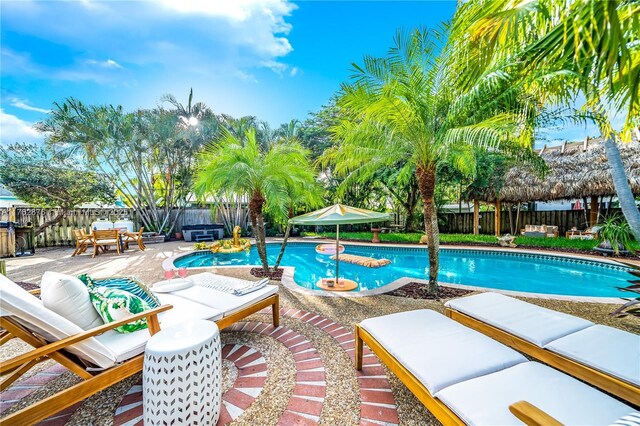 view of swimming pool featuring a patio area, a fenced in pool, and a fenced backyard