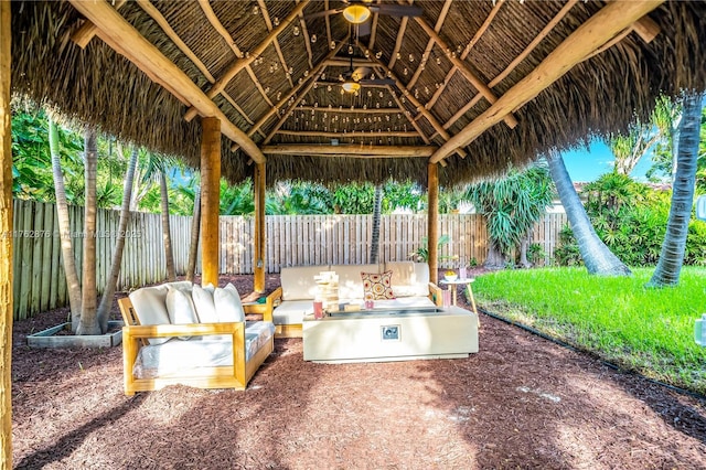 view of patio / terrace with a gazebo, a fenced backyard, and an outdoor hangout area