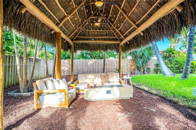 view of patio with a gazebo, an outdoor hangout area, and a fenced backyard