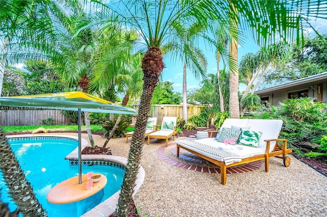 view of pool featuring a patio area and a fenced backyard