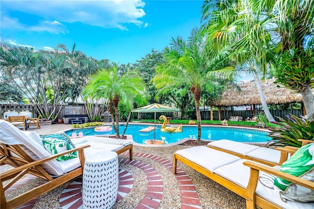 view of swimming pool with a patio, a fenced backyard, and a fenced in pool