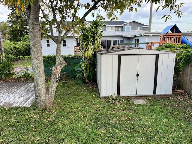 view of shed featuring fence