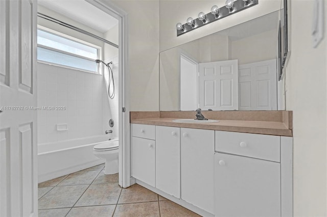 full bath featuring tile patterned floors, bathing tub / shower combination, toilet, and vanity