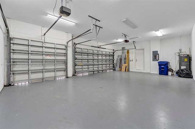 garage with electric panel, electric water heater, and a garage door opener