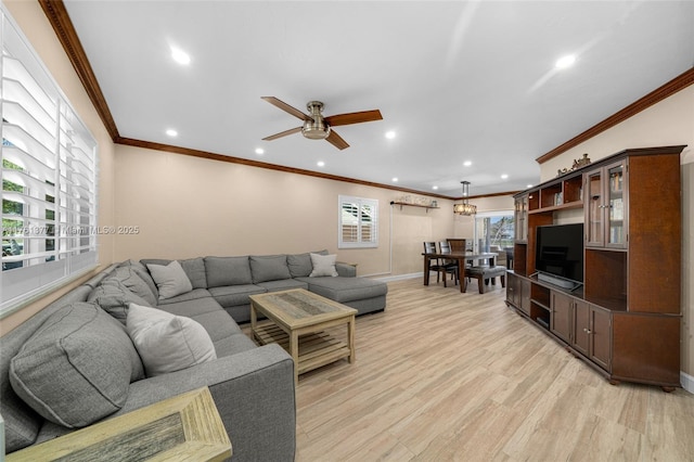 living area featuring light wood-style flooring, recessed lighting, crown molding, baseboards, and ceiling fan