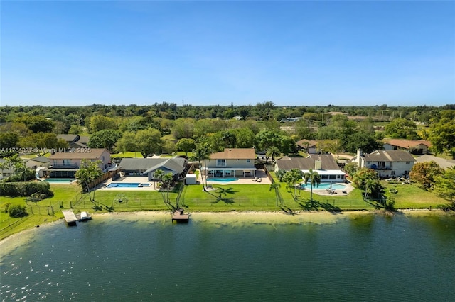 drone / aerial view featuring a water view and a residential view