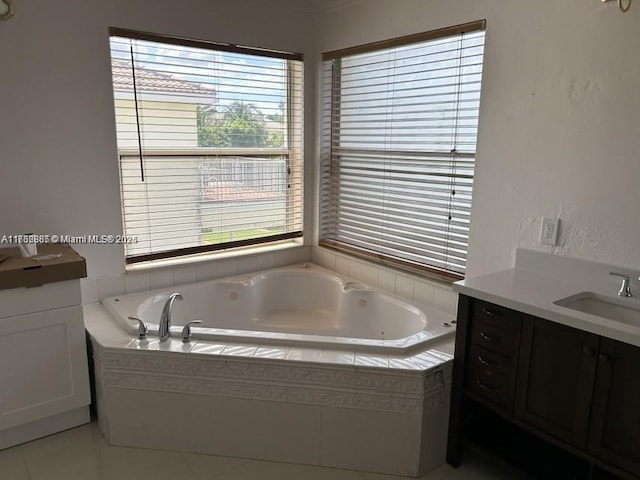 full bathroom featuring vanity and a whirlpool tub