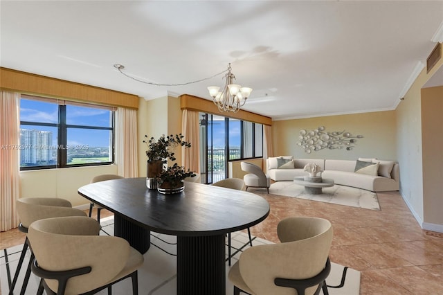 dining room with visible vents, baseboards, an inviting chandelier, and ornamental molding