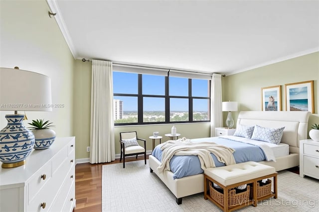 300 Three Islands Blvd Unit 518, Hallandale Beach, FL 33009 - bedroom with ornamental molding and light wood-style flooring