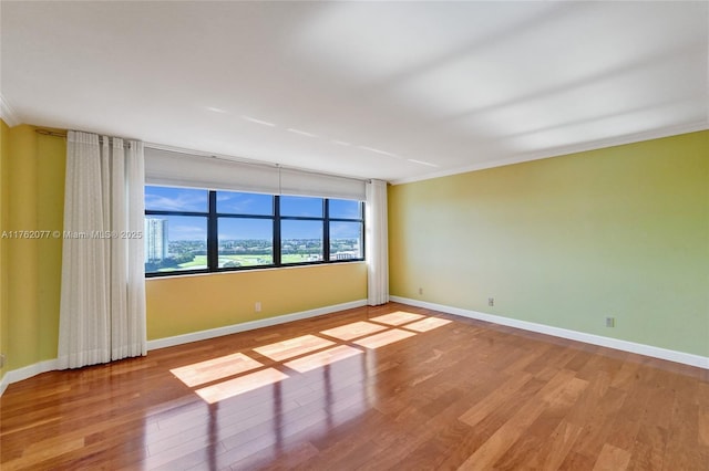 300 Three Islands Blvd Unit 518, Hallandale Beach, FL 33009 - spare room featuring wood finished floors and crown molding