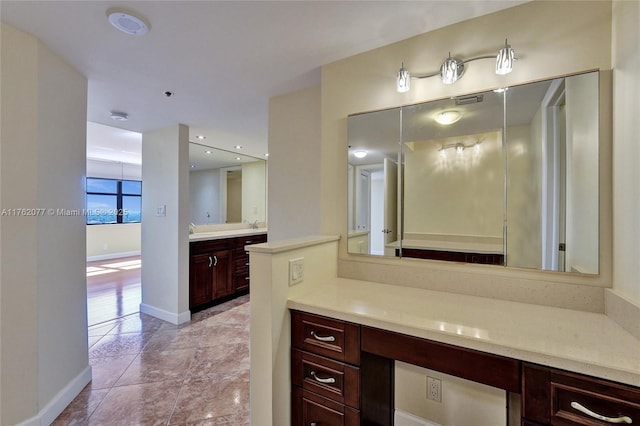 full bath featuring visible vents, baseboards, vanity, and tile patterned flooring