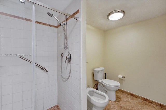 bathroom featuring tile patterned flooring, a shower stall, toilet, and a bidet