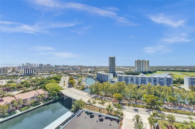 birds eye view of property featuring a city view and a water view