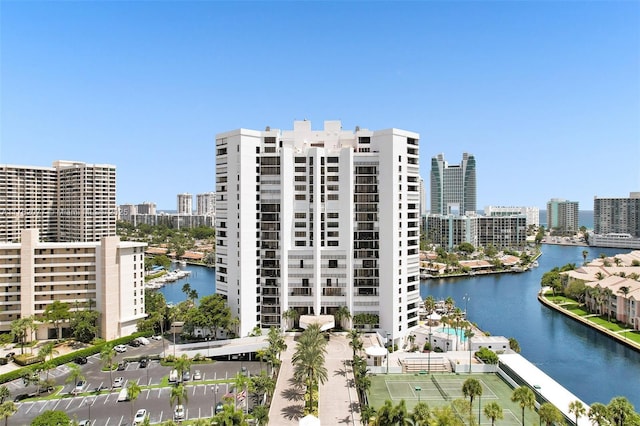 view of property featuring a view of city and a water view