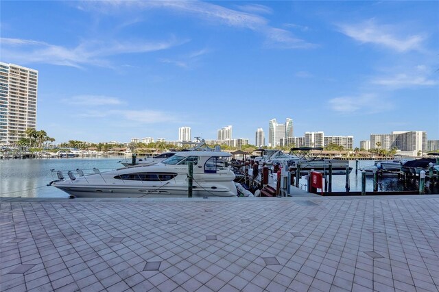 300 Three Islands Blvd Unit 518, Hallandale Beach, FL 33009 - dining area with carpet floors, plenty of natural light, a paneled ceiling, and a city view